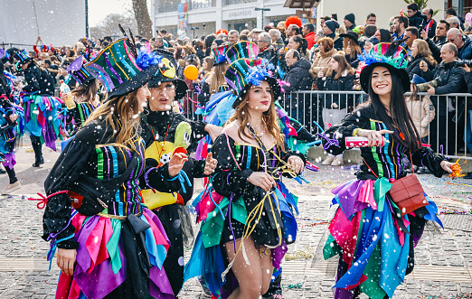 Xanthi, Greece - February 18, 2018: Group of tourist and Greek people celebrating on street in the annual Carnival Parade Festivali ( İskeçe Karnavalı) dressed in different colorful costumes. Over the last decades the Carnaval of Xanthi is one of the most important festivals of Carnival all over Greece in Rodopi, Xanthi.