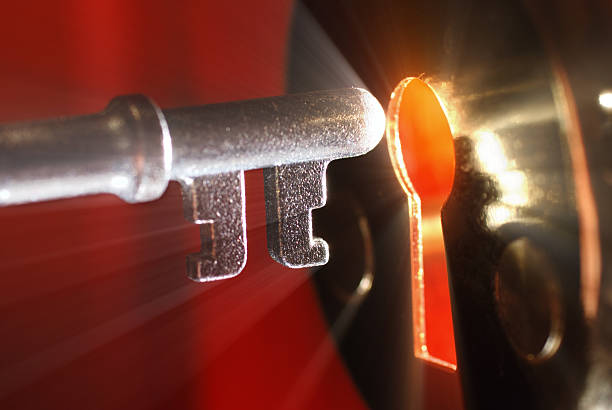 Key & keyhole with light  unlocking stock pictures, royalty-free photos & images