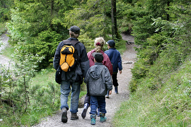 istock Family Hike on wooded path 92240949