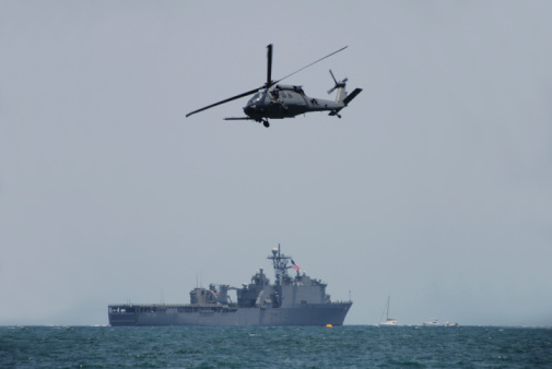 Two military helicopter flying.