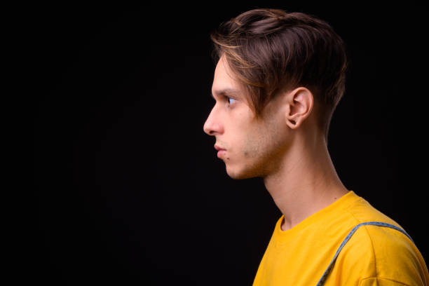 istock Portrait Of Handsome Man Against Black Background 922413456
