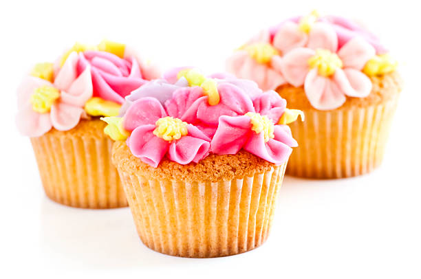 Cream cupcakes.cakes on a pink background.Cream dessert.