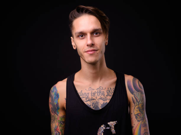 istock Portrait Of Handsome Man Against Black Background 922415456