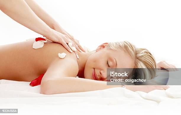 Professional Massage With Flower Petals 2 Stock Photo - Download Image Now - Back, Beautician, Beautiful People