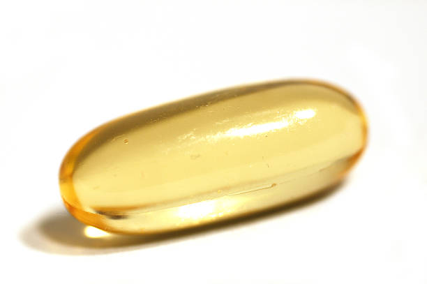 Golden Pill  sooth stock pictures, royalty-free photos & images