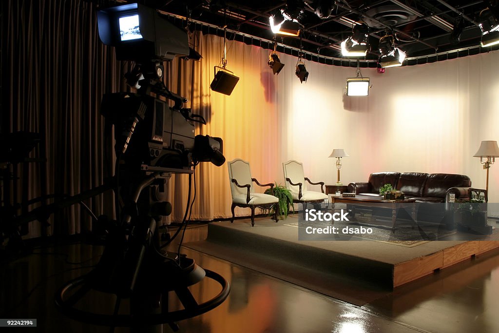 Life's a Stage Part 1 TV production studio with a stage being set up with props and proper lighting Studio - Workplace Stock Photo