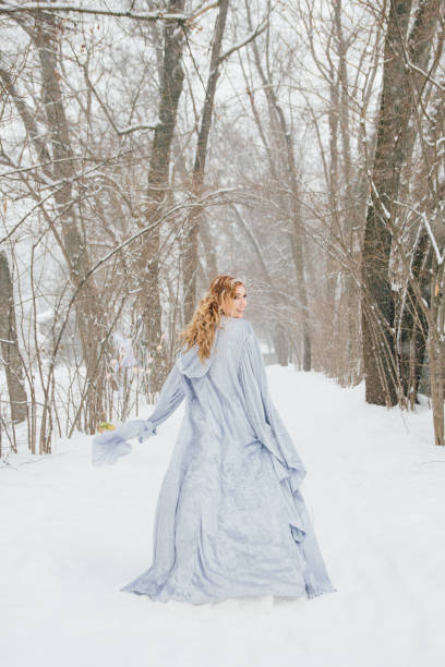 istock Beautiful girl  under the snowfall 922423934