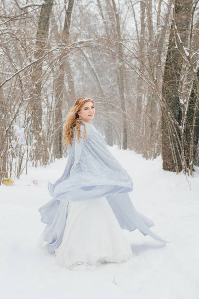 istock Beautiful girl  under the snowfall 922424058