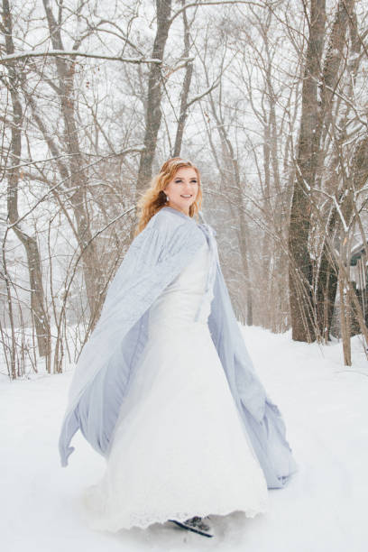 istock Beautiful girl  under the snowfall 922424112