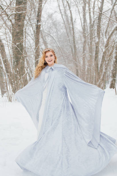 istock Beautiful girl  under the snowfall 922424192