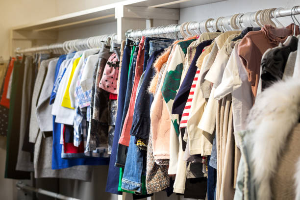 istock Clothes hang on a shelf in a designer store 922427662