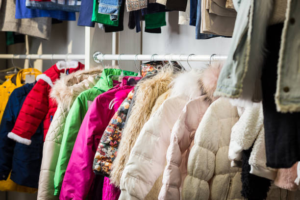 istock baby clothes hang on a shelf in a designer store 922427808