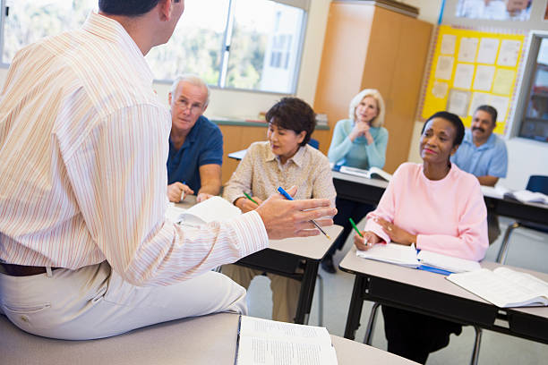 istock Mature students and their teacher in a classroom 92242968