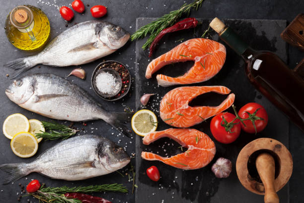istock Raw salmon and dorado fish fillet 922435978