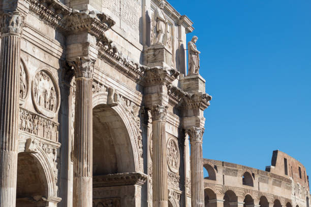 istock Constantine's Arch with the Coliseum behind, against clear blue sky. 922439948