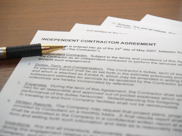 Contracting Papers Independent Contractor Agreement Document with a pen to sign independent stock pictures, royalty-free photos & images