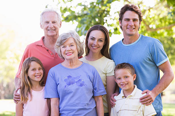 istock Family standing in park 92244218