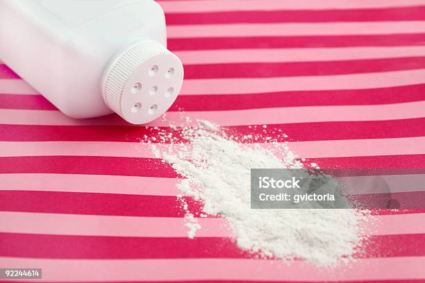 Baby Powder Spilled From The Bottle On Red And Pink Towel Stock Photo - Download Image Now