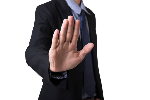 istock businessman with hand showing gesture stop isolated on white background. 922448004
