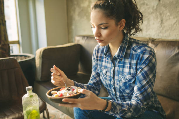 istock Woman eating cereals 922448074