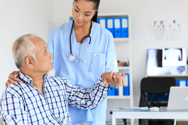 istock Female doctor examinates senior patient 922448176