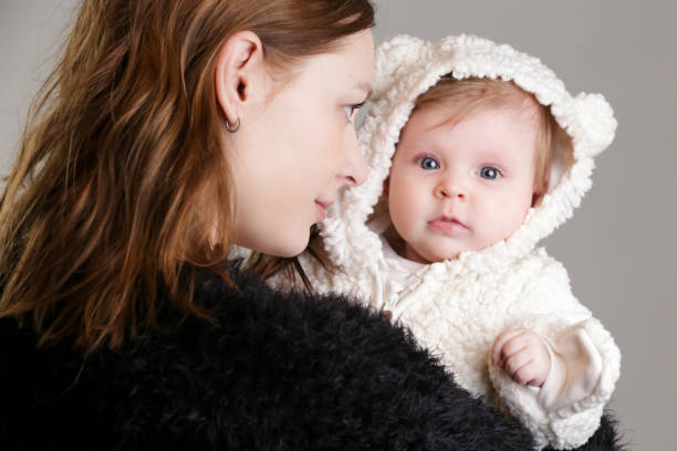 istock Mother holding her newborn baby 922448470