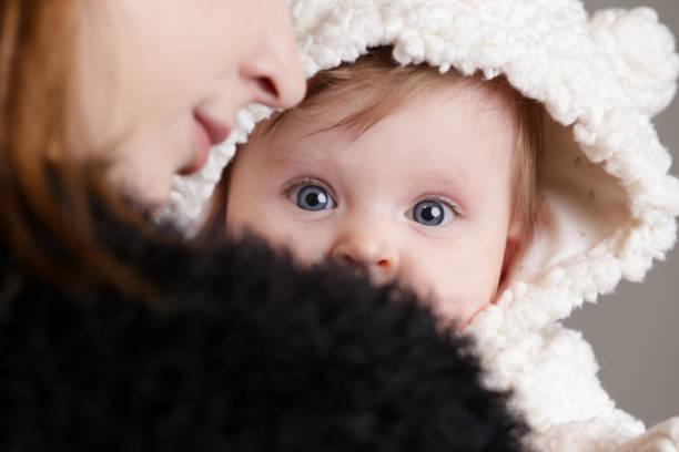 istock Mother holding her newborn baby 922448542