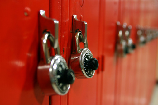 Row of red lockers with short depth of field.