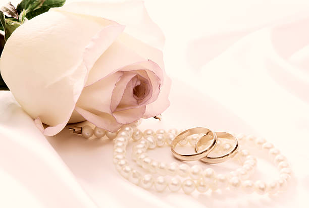 istock Rose, pearls and wedding rings 92245208