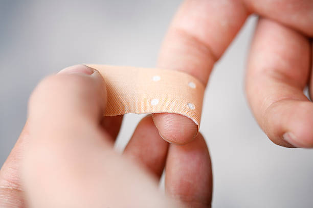 Bandaging finger stock photo
