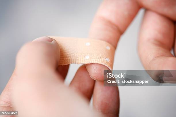 Bandaging Finger Stock Photo - Download Image Now - Adhesive Bandage, Wound, Textile