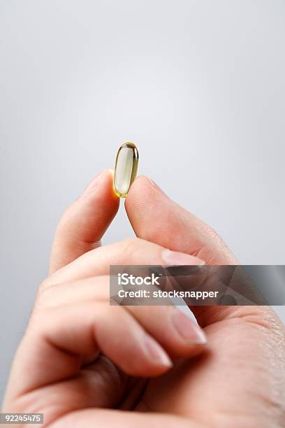 Omega3 Stock Photo - Download Image Now - Capsule - Medicine, Gripping, Small
