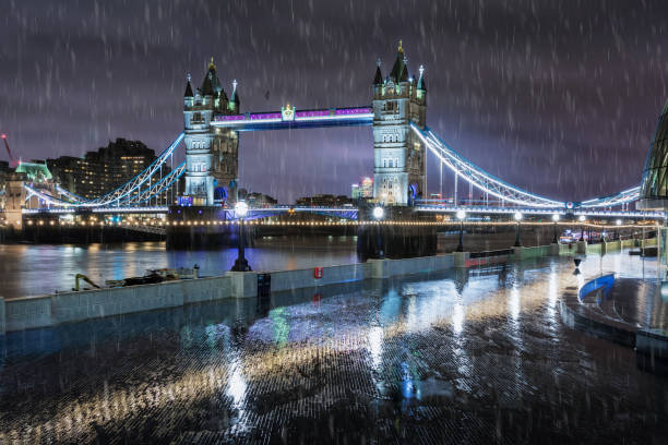 The Tower Bridge in London on a rainy winter night, United Kingdom