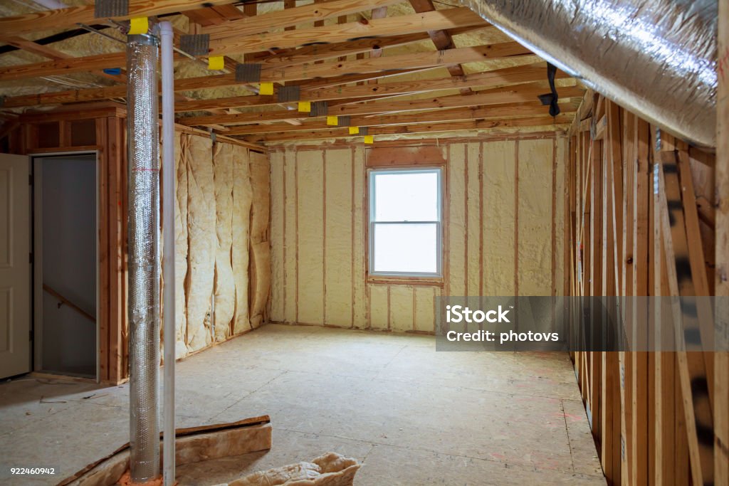 Attick loft insulation partly isolated wall Attick loft insulation partly isolated wall Heat isolation in a new house Insulation Stock Photo
