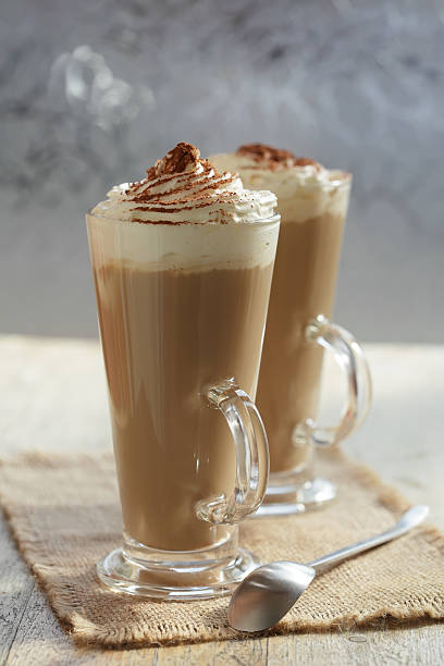 istock coffee latte macchiato with cream in glasses on window backgroun 92246369