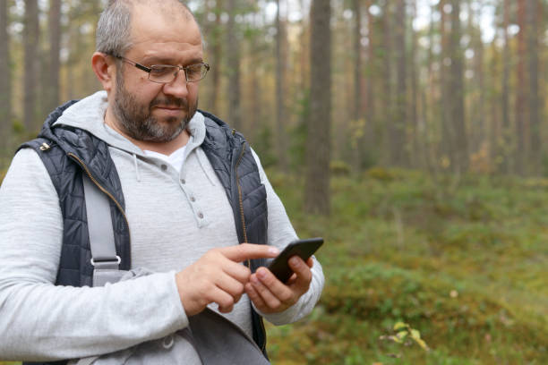istock Male hand holding mobile phone 922464906