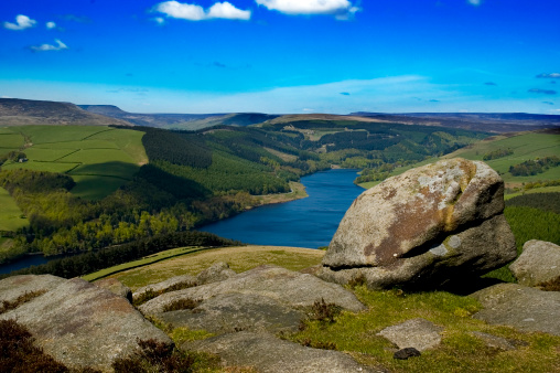 View from a peak in the Peak District, Derbyshire UK over Ladybower Reservir on a bright sunny day