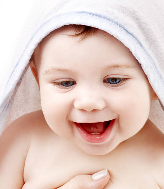 istock happy baby with terry hoodie robe on head 92246688