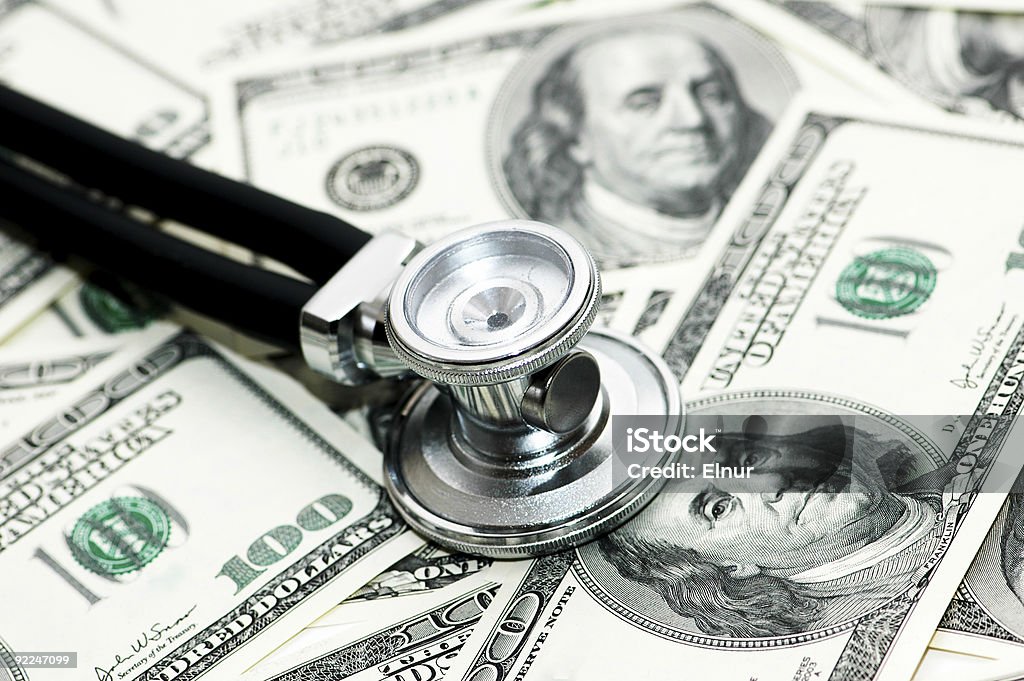 Medical concept -  stethoscope over the dollar bills  Backgrounds Stock Photo