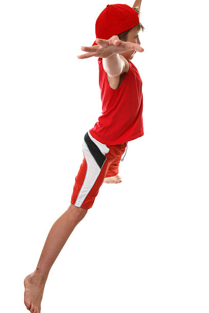 istock Active boy doing fitness star jumps 92247289