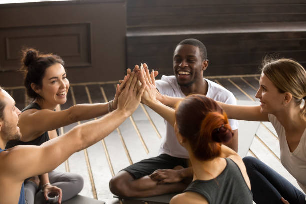 istock Fit sporty happy people giving high five at group training 922482684