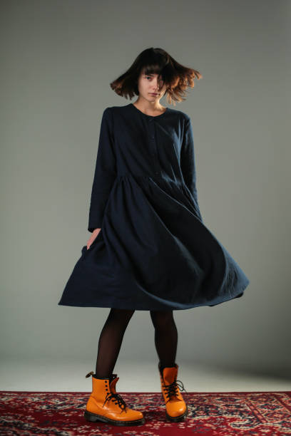 istock Attractive young woman is spinning isolated in studio 922483274