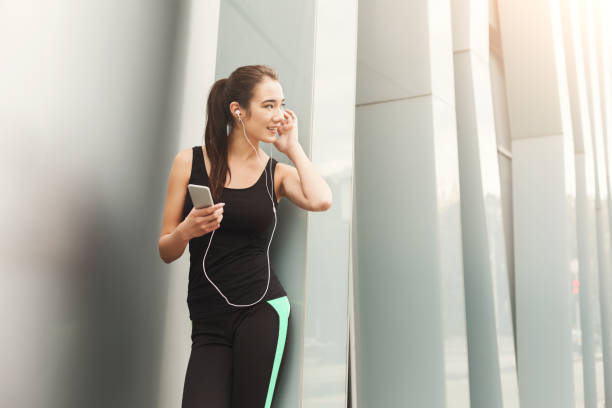 istock Cheerful sporty woman having rest after workout 922483706