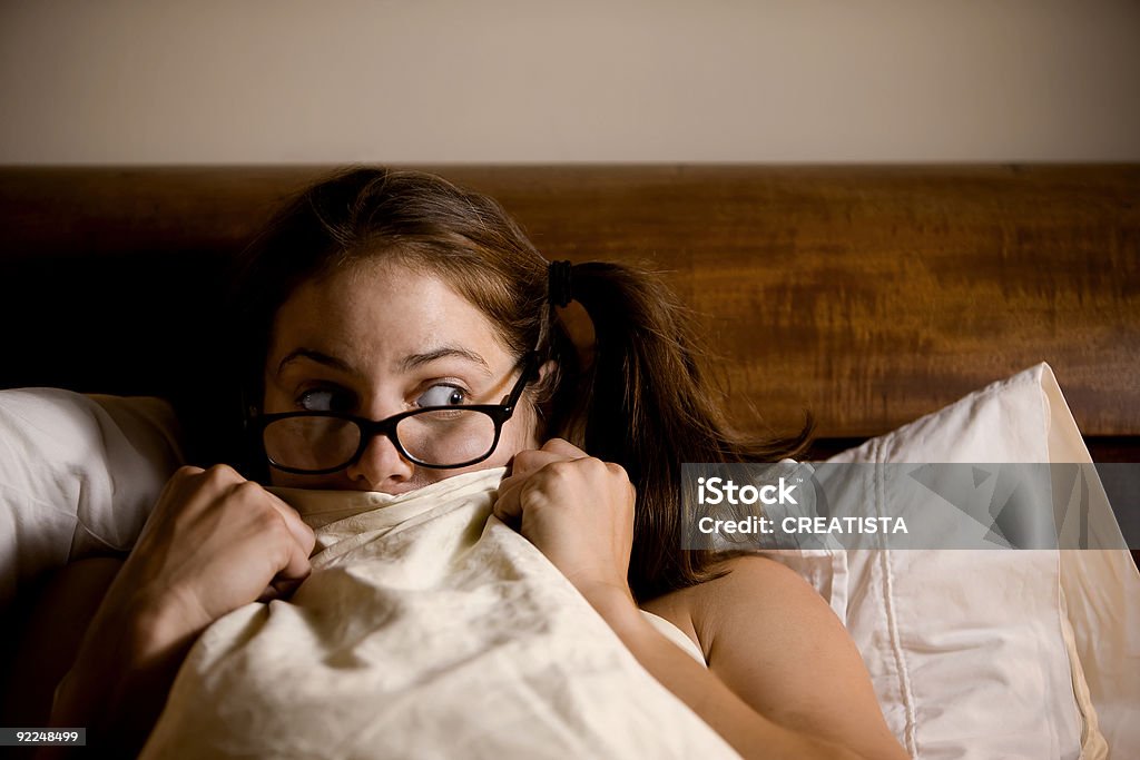 Frightened Woman in Bed  Adult Stock Photo