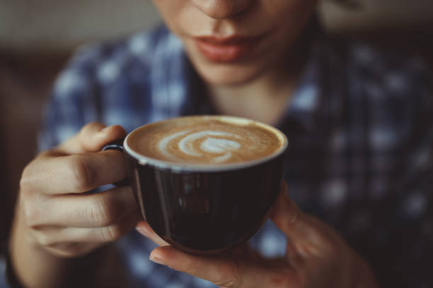 istock Woman with cappuccino 922487394