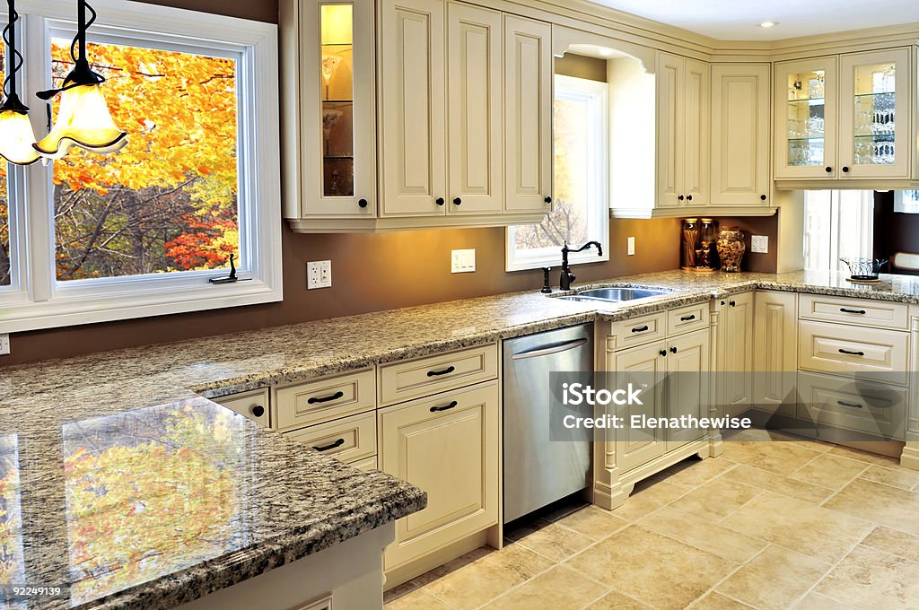 The Interior of a modern kitchen in a home with marble Modern luxury kitchen interior with granite countertop Granite - Rock Stock Photo