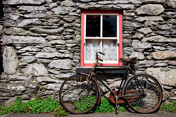 istock old bicycle by rural cottage wall 92249827