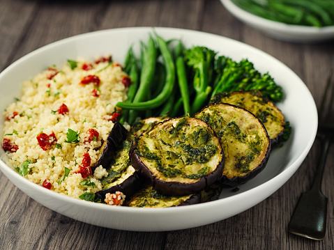 Home made freshness roasted aubergine with garlic herb with couscous salad and green beans and broccoli stem