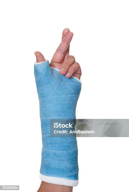 Left Arm In Cast With Fingers Crossed For Luck Stock Photo - Download Image Now - Broken Arm, Orthopedic Cast, Fingers Crossed