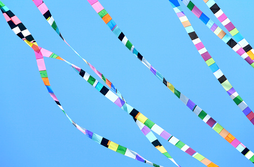 Colorful Kite Flying in blue spring sky